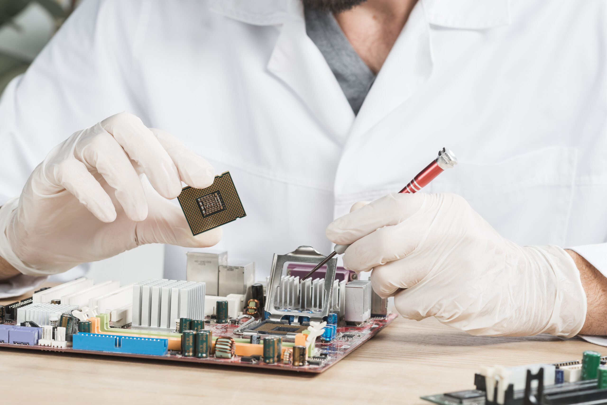 close-up-male-technician-holding-computer-chip